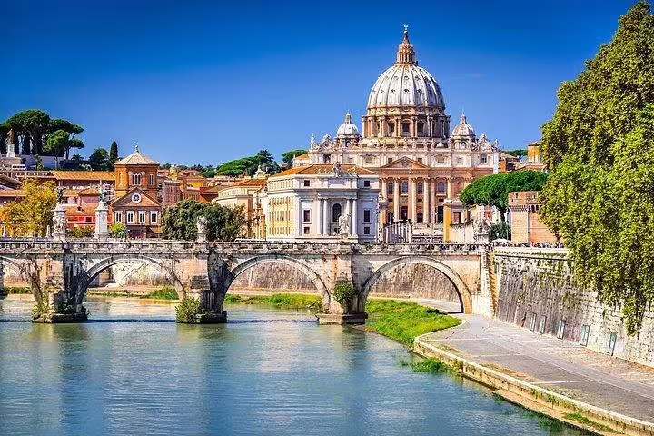 Panoramic view of St Peter’s Basilica dome and Castel Sant’Angelo from the Tiber River, Rome combo tour sightseeing