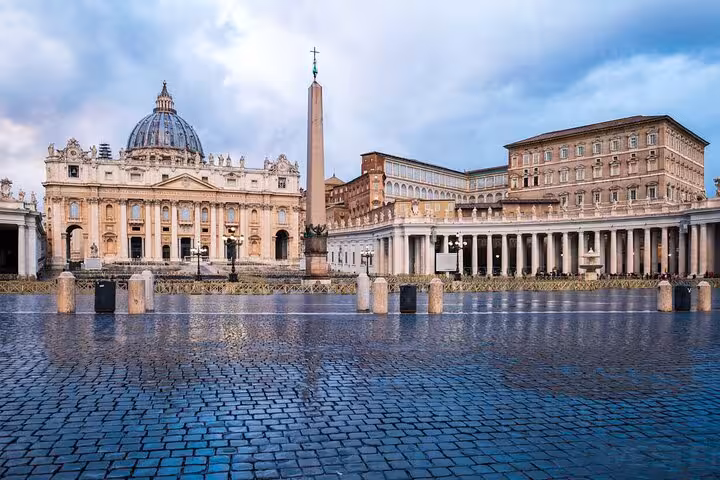 St. Peter's Basilica and St. Peter's Square at dawn, highlighting the entry point for the dome climb and underground Rome tour.