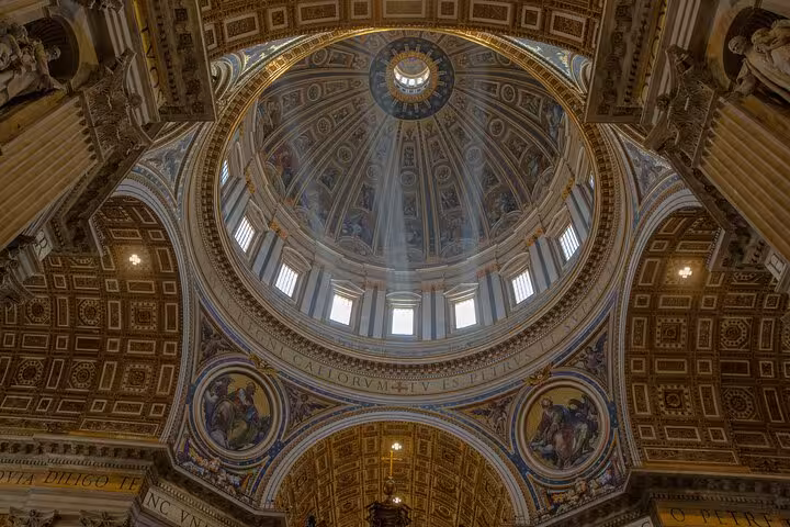 Majestic view of St. Peter's Basilica dome, showcasing intricate architectural details on the Rome private tour.