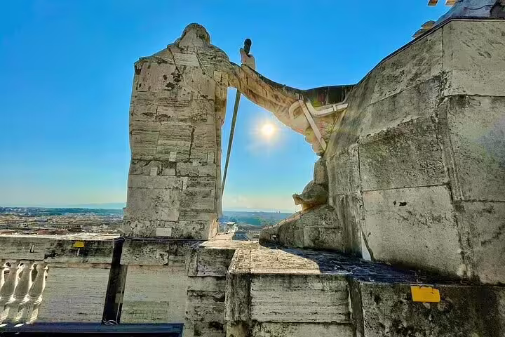 Sunrise over Rome from St Peter’s Basilica rooftop during VIP early morning private dome climb tour in Vatican City