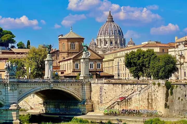 Panoramic view of St Peter’s Basilica and Rome skyline from the Tiber River bridge on an exclusive Vatican City shore excursion