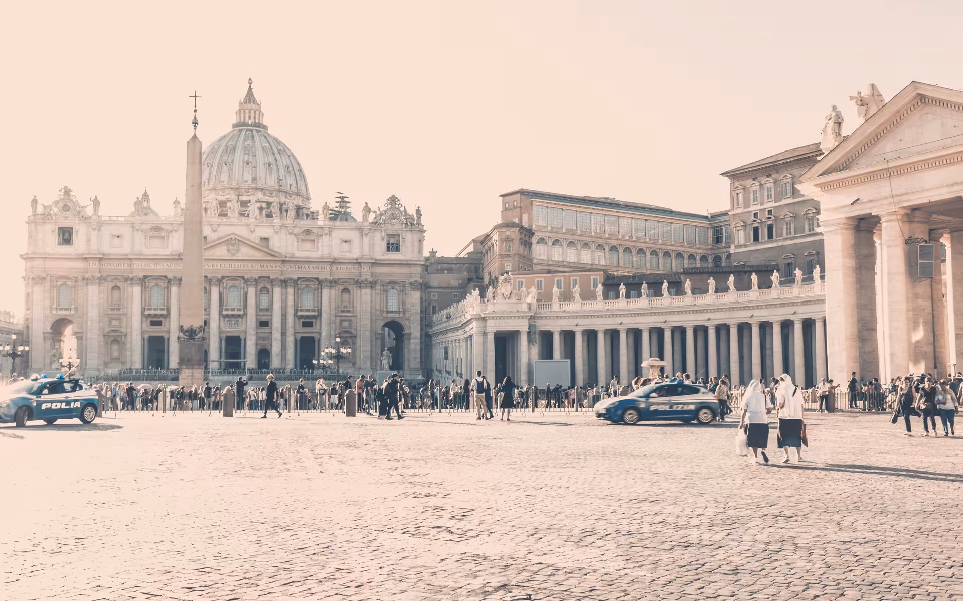St. Peter's Basilica and bustling Vatican City square with visitors exploring iconic religious and cultural landmarks.