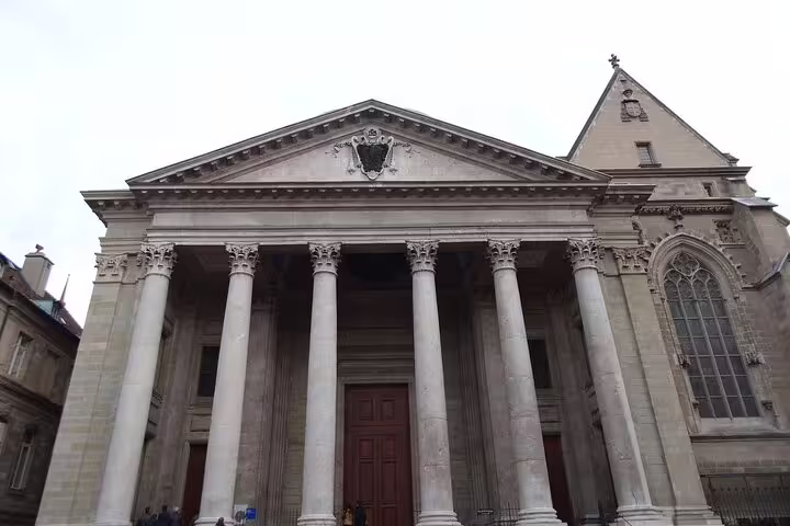 Neoclassical facade of St. Pierre Cathedral in Geneva with Corinthian columns and triangular pediment