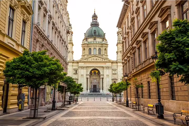 Cobblestone pedestrian street leading to St. Stephen's Basilica in Budapest's Jewish Quarter