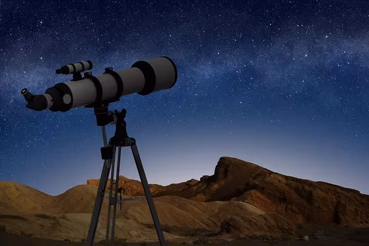 Telescope under Milky Way above Hurghada desert mountains on Jeep stargazing safari with Bedouin dinner