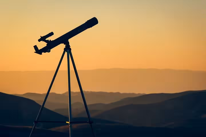 Telescope set up at sunset in Hurghada desert for stargazing safari by Jeep, before Bedouin dinner under stars