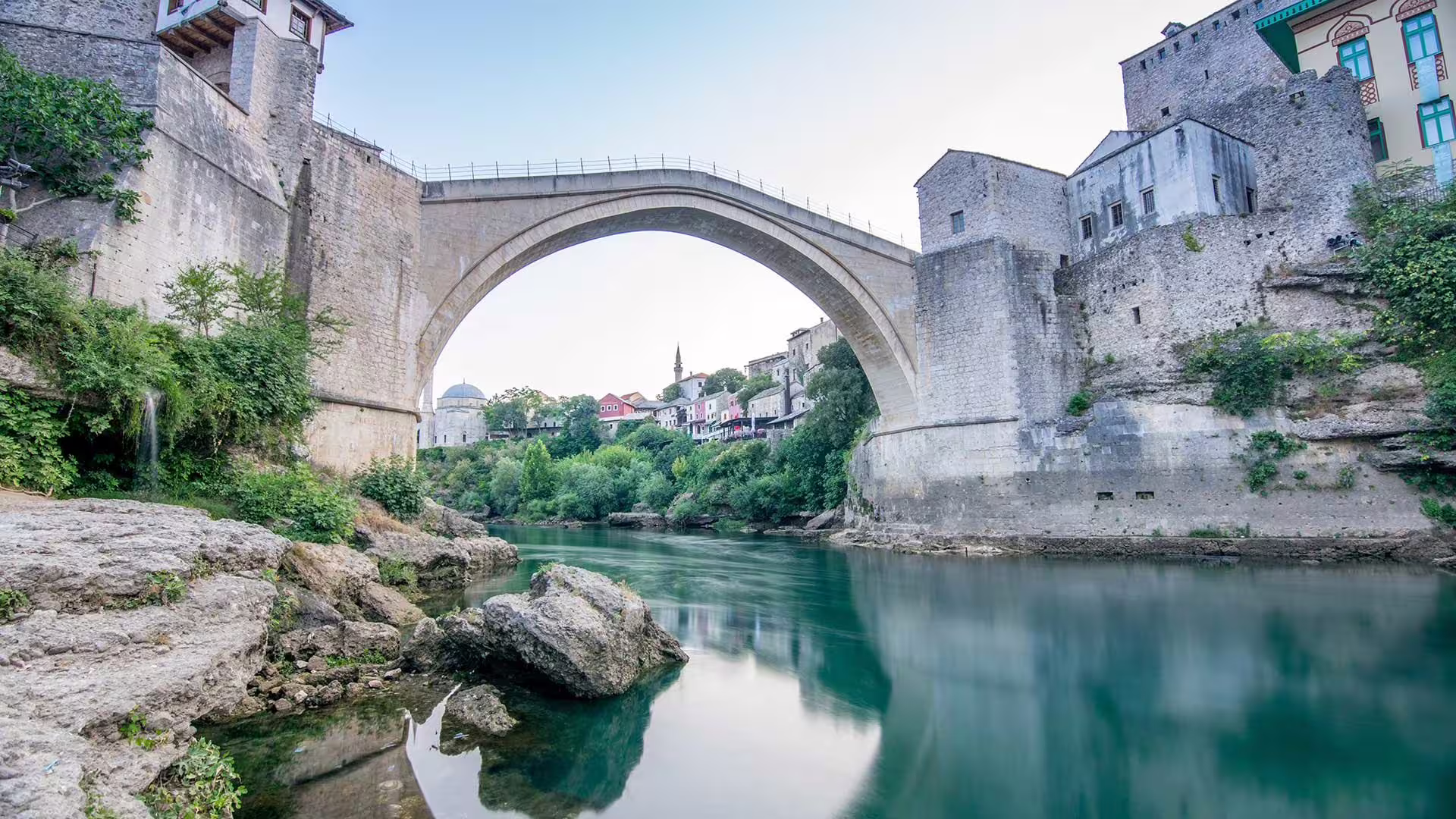 View from below Stari Most in Mostar with turquoise Neretva River, on day trip to Mostar and Kravice