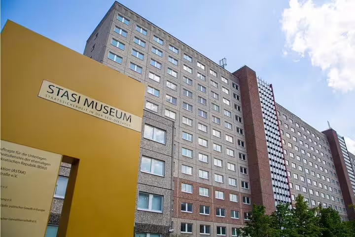 Stasi Museum building with yellow sign in East Berlin, former East German secret police headquarters