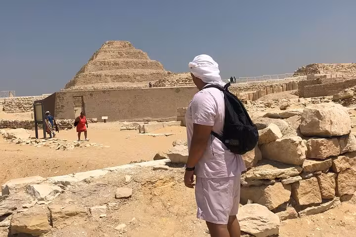 Tourist viewing the Step Pyramid of Djoser at Saqqara on a private all-inclusive Cairo tour with Memphis and Dahshur