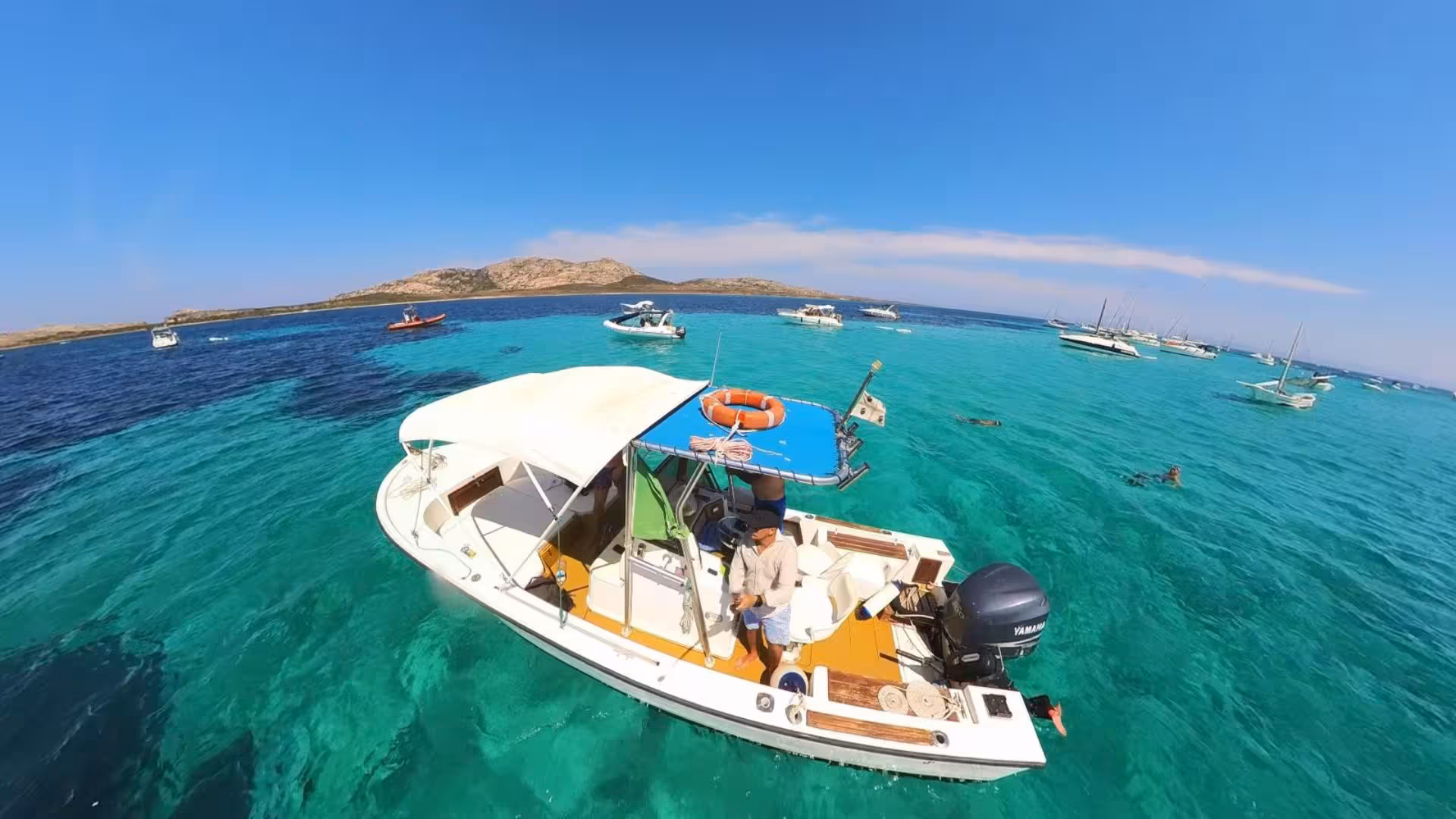 Scenic boat trip from Stintino to Asinara with azure waters, highlighting the perfect summer getaway in Sardinia.