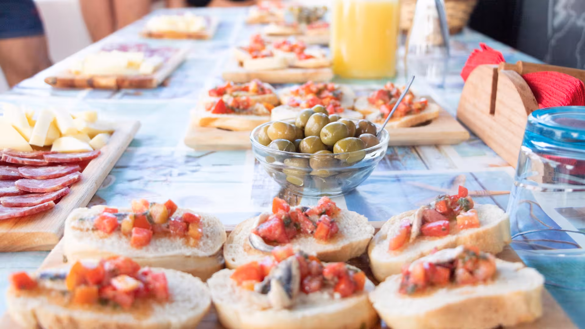 Enjoy a delicious spread of Italian appetizers on a Stintino catamaran tour to Asinara Island.