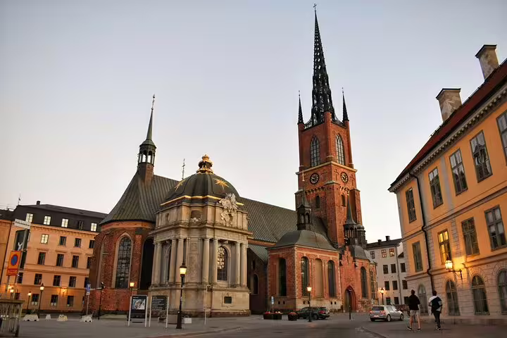 Riddarholmen Church with iron spire and baroque chapel at dusk in Stockholm's Old Town