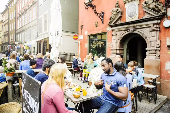 Outdoor café in Stockholm Old Town, a lively stop on a self-guided e-scavenger hunt walking tour