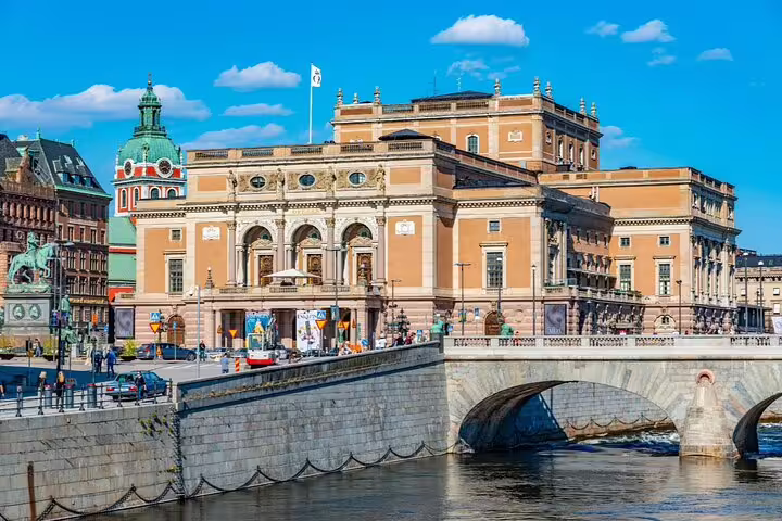 Royal Swedish Opera building with arched bridge over water in Stockholm city center