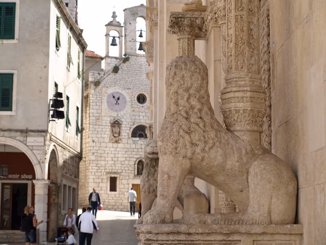Stone lion at St James Cathedral entrance in Šibenik old town, a highlight on the Zadar to Šibenik tour