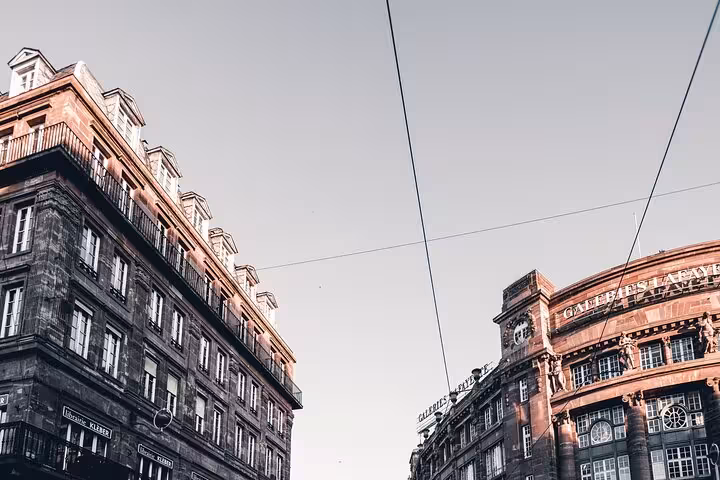 Historic Strasbourg city center buildings including Galeries Lafayette under a clear sky