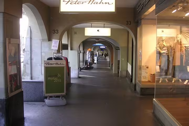 Covered shopping arcade with Peter Hahn store and arched walkway in Strasbourg old town