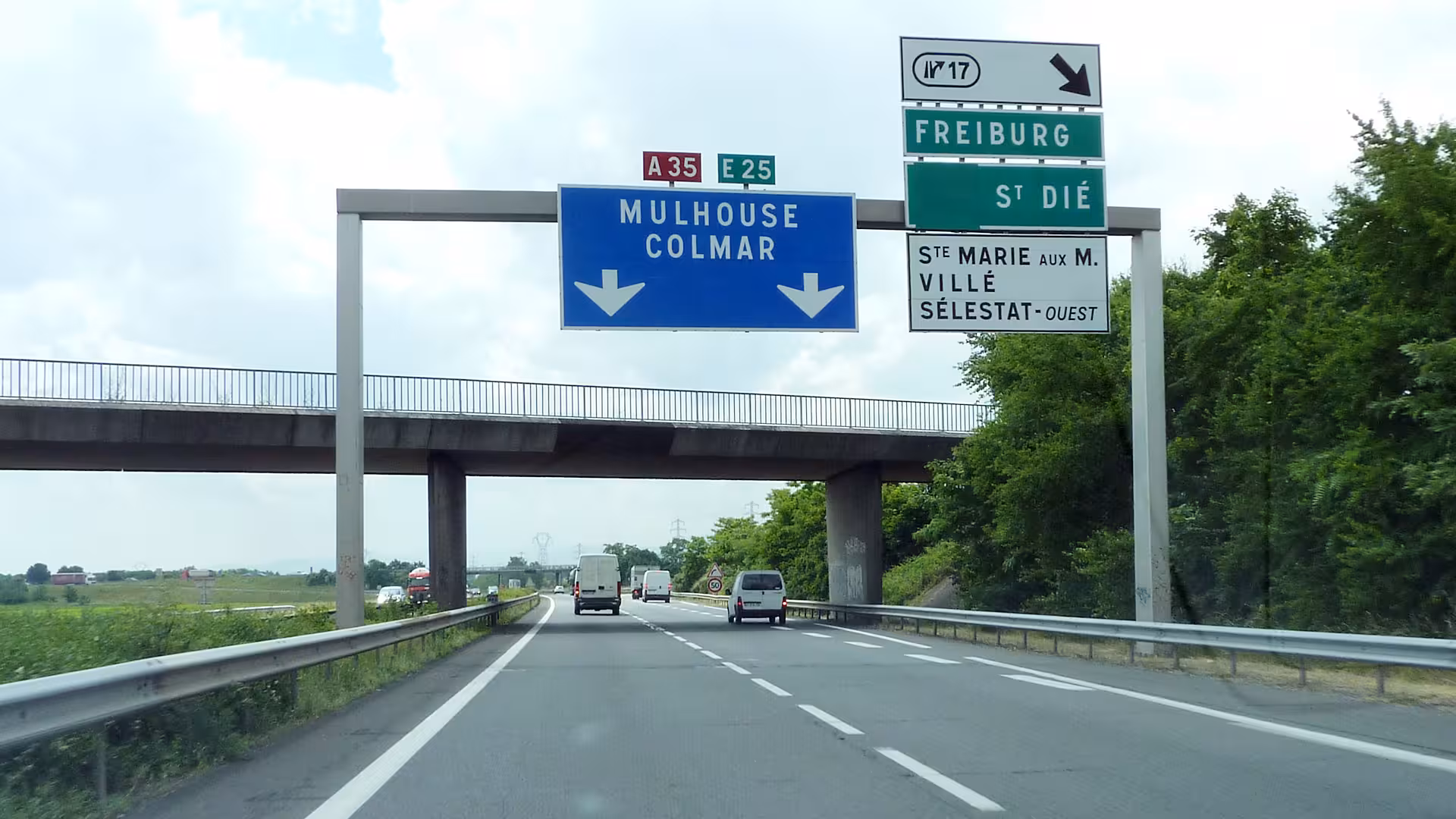 Highway A35 E25 sign directing toward Colmar and Mulhouse in Alsace, France