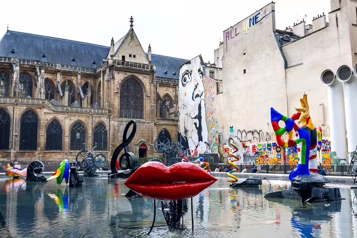 Colorful sculptures in Stravinsky Fountain near the Louvre, perfect stop on Paris private tour with skip-the-line tickets.