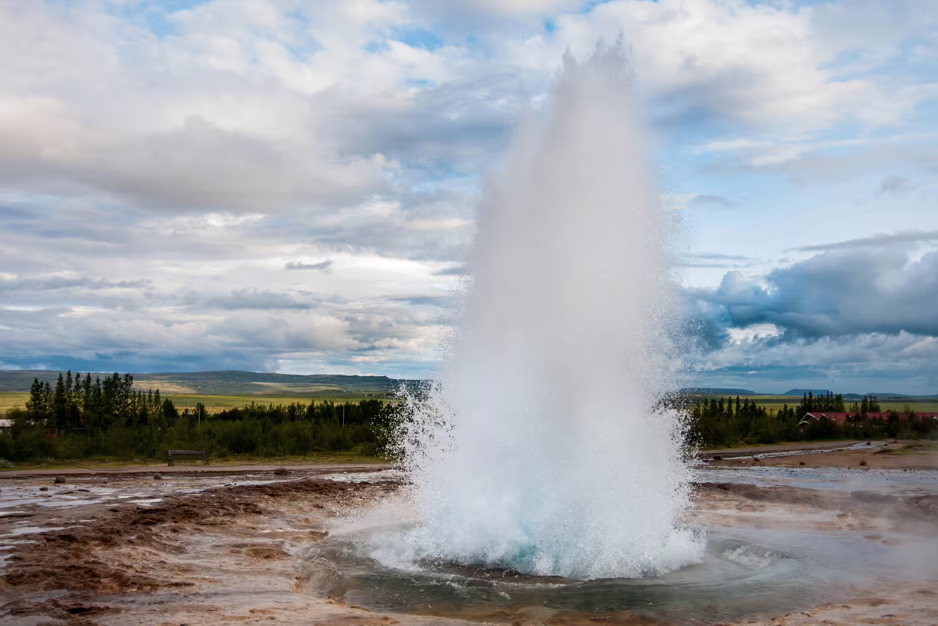 Strokkur geyser erupting in Iceland on a private Golden Circle day tour from Reykjavik with guide