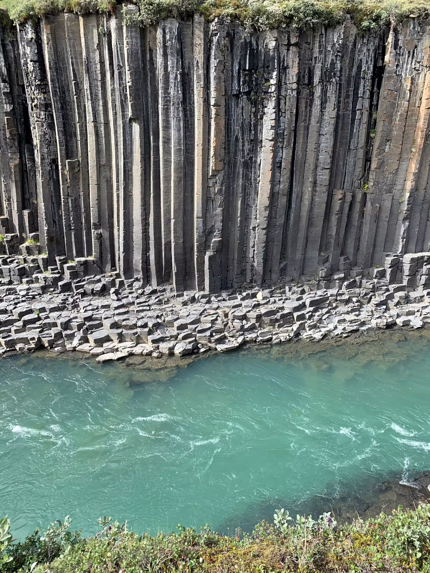 Stunning basalt column canyon with turquoise glacial river at Stuðlagil Iceland Grand Tour 12-day adventure