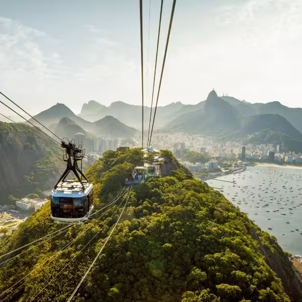 Scenic cable car ride to Sugarloaf Mountain offers panoramic views of Rio's lush landscape and bustling cityscape.