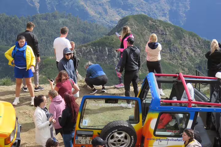 Tourists explore scenic mountain vistas in the Sunny Southwest, ideal for rum tastings, banana plantations, waterfalls, and lighthouse tours.