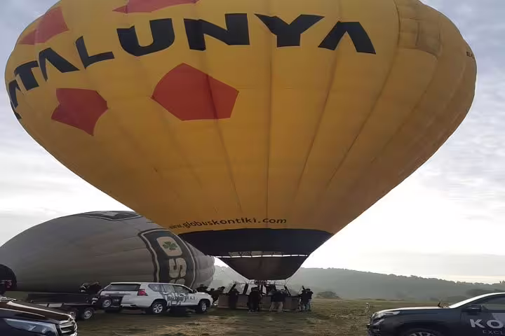 A vibrant hot air balloon takes off in Igualada, offering breathtaking views and an exhilarating adventure in Catalonia.