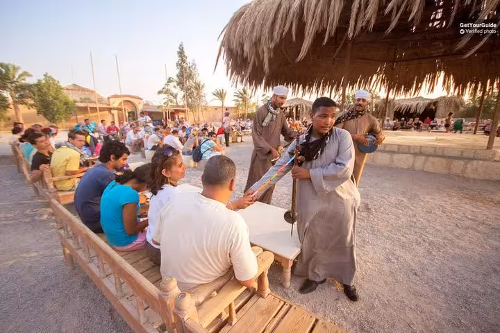 Bedouin village show near Hurghada, guests seated for tea on sunset 5-hour ATV buggy jeep desert safari