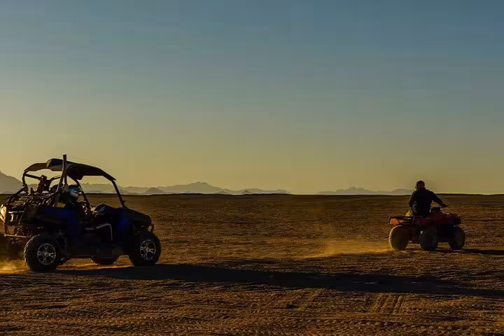 Sunset desert safari near Sharm El Sheikh with quad bike and dune buggy ride across wide Sinai landscape