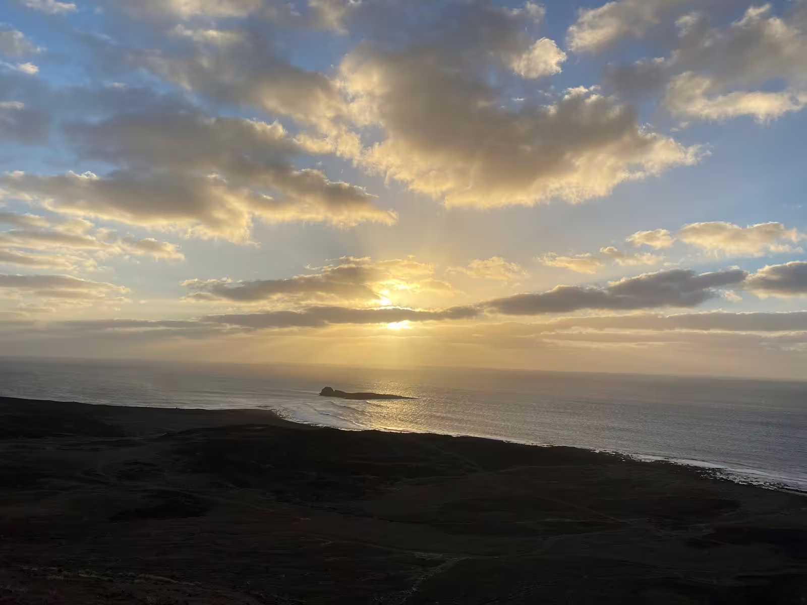 Golden sunset over the Atlantic coastline from Mount Lion viewpoint, a scenic highlight of the sunset hike