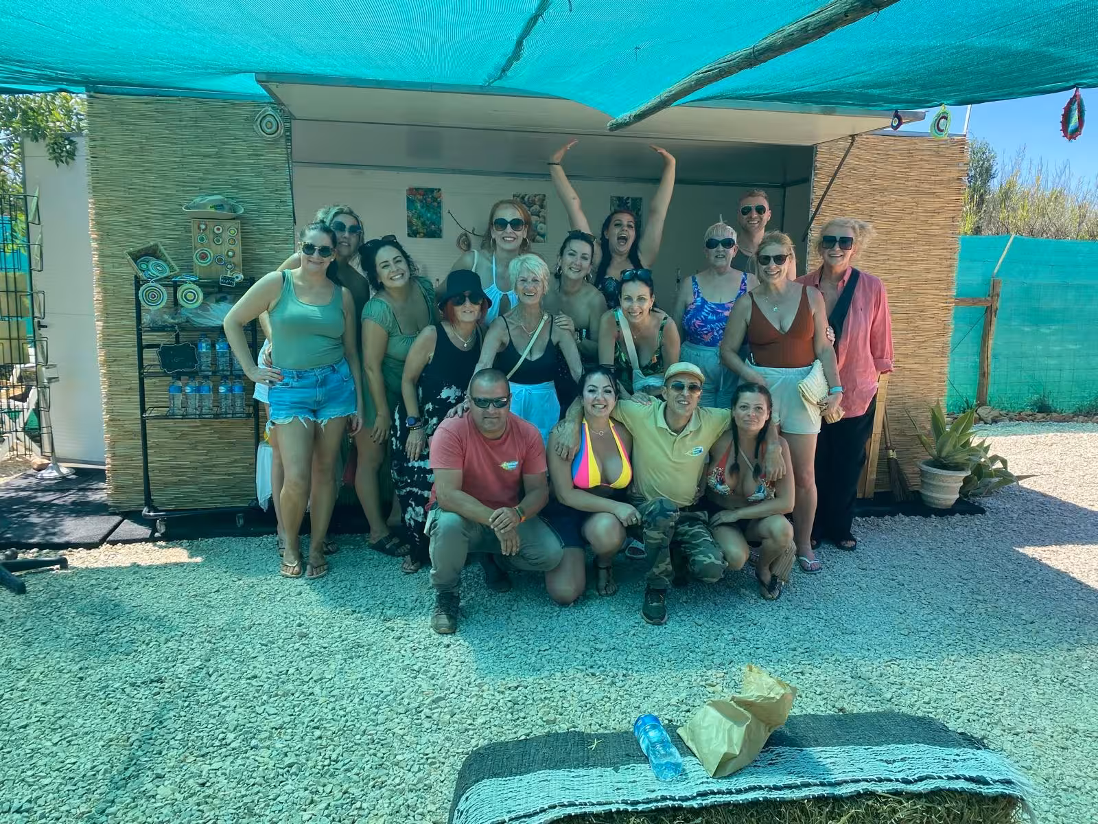 Happy Sunset Jeep Safari group in Algarve posing together under a shaded rural stall before dinner and evening adventure