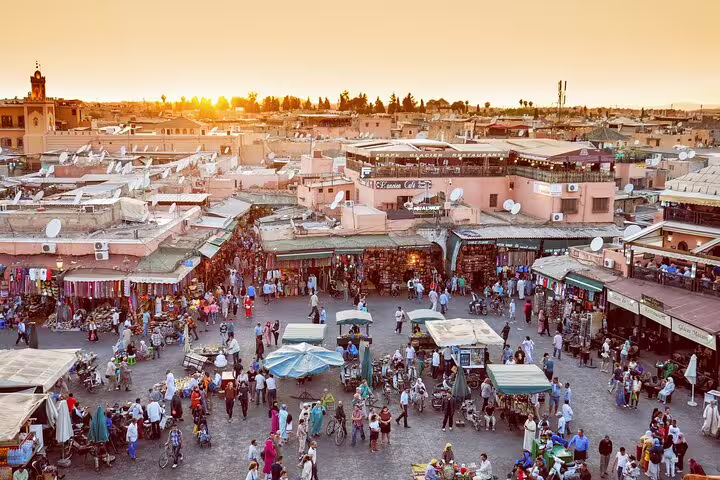 Sunset over Jemaa el-Fnaa square in Marrakech medina, lively souks on Morocco 11 days tour from Marrakech