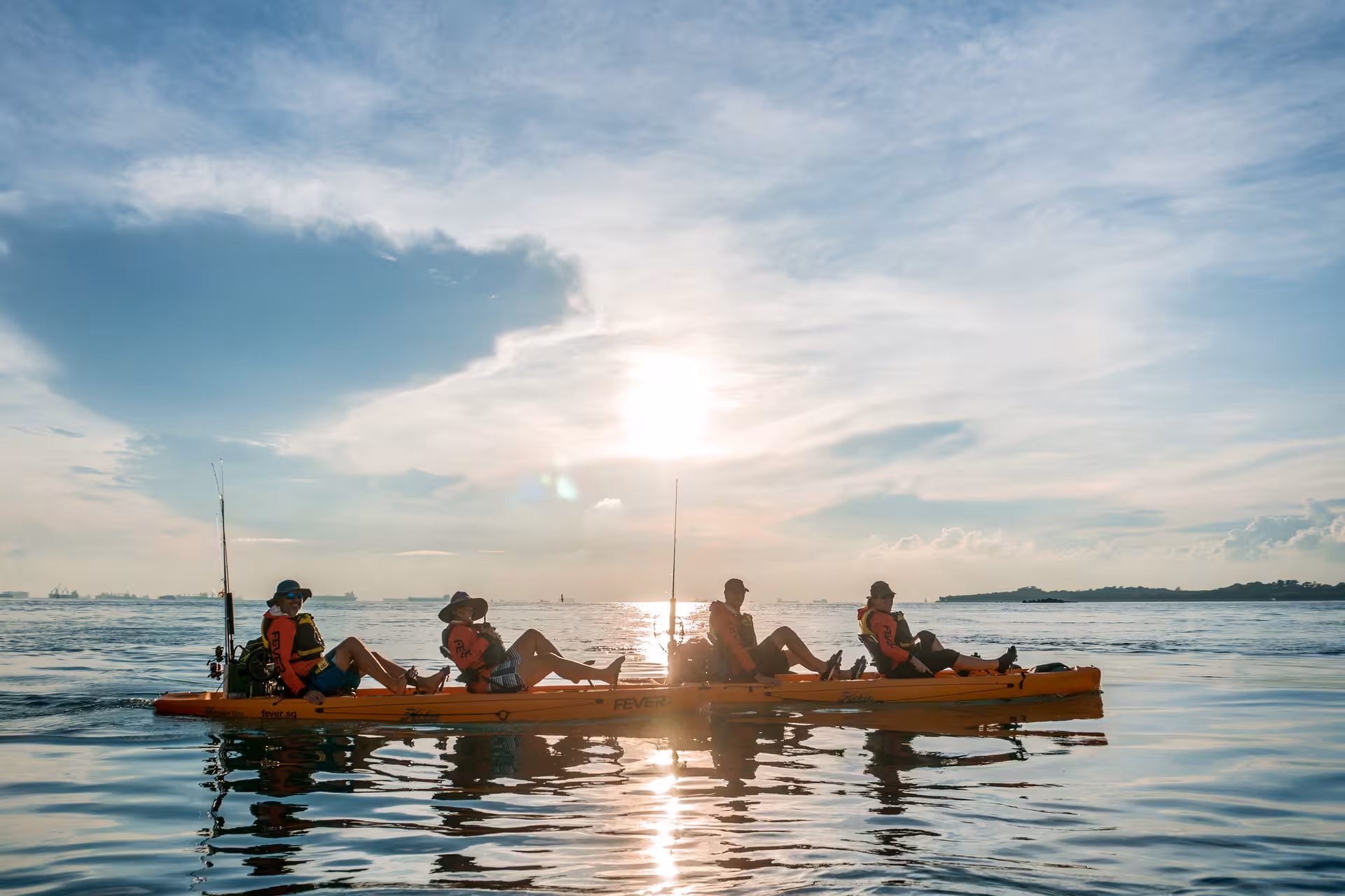 Sunset kayaking adventure on Saint John Island tour, silhouetted against serene waters, ideal for nature enthusiasts.