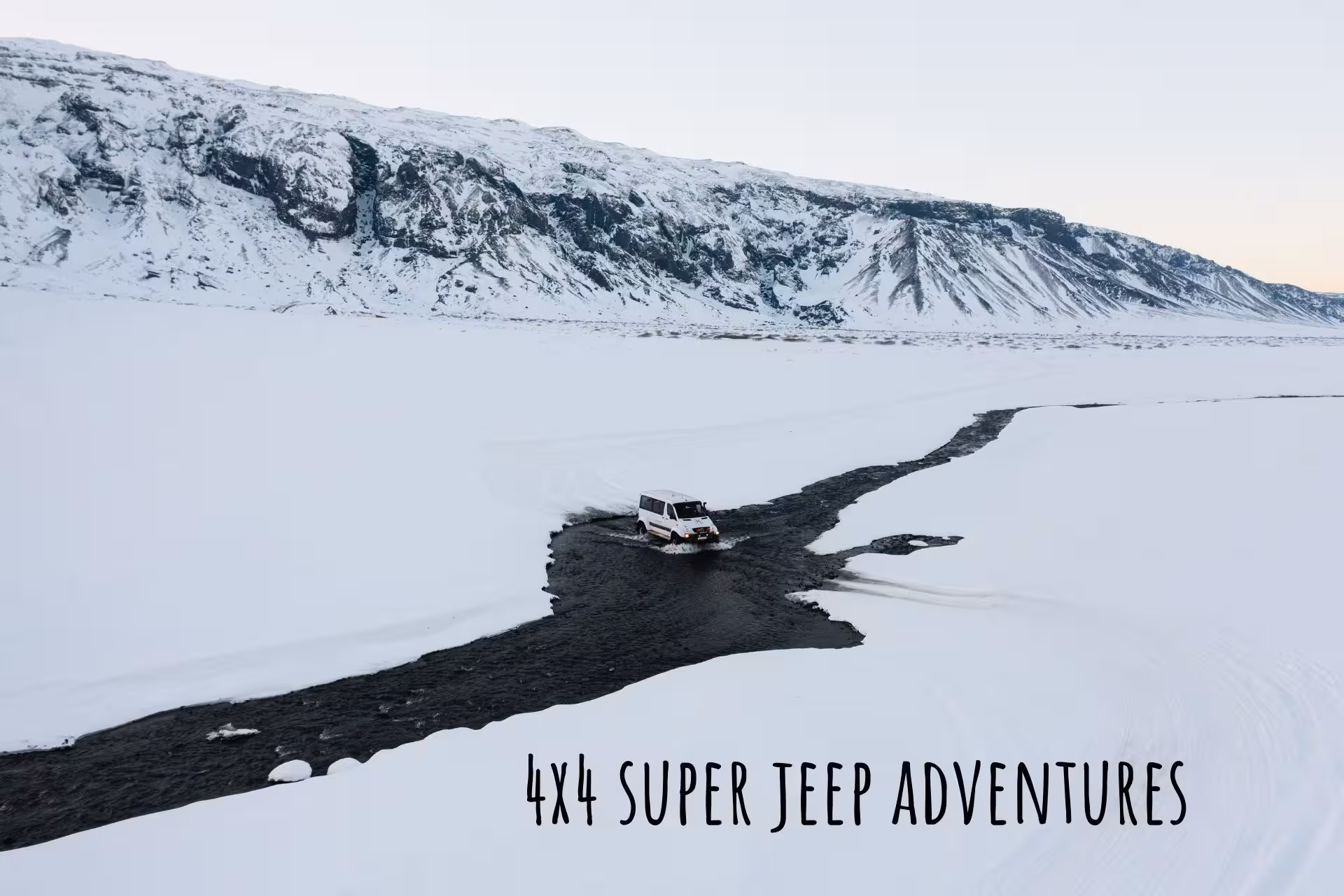 White 4x4 super jeep crossing a frozen river in snowy South Iceland winter landscape