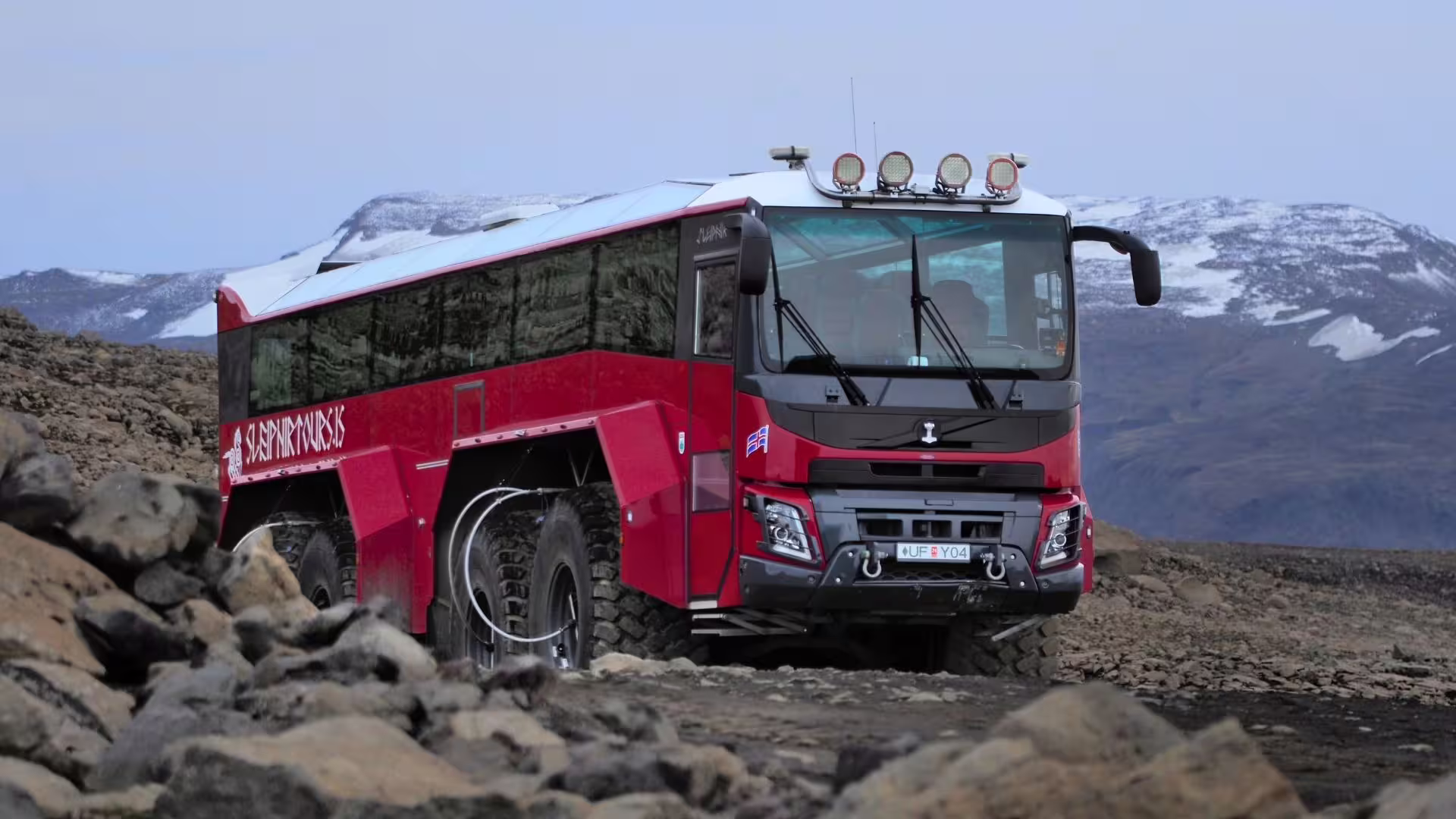 Super jeep-style glacier bus on rugged highlands en route to Langjökull Glacier, Summer Solstice tour from Gullfoss