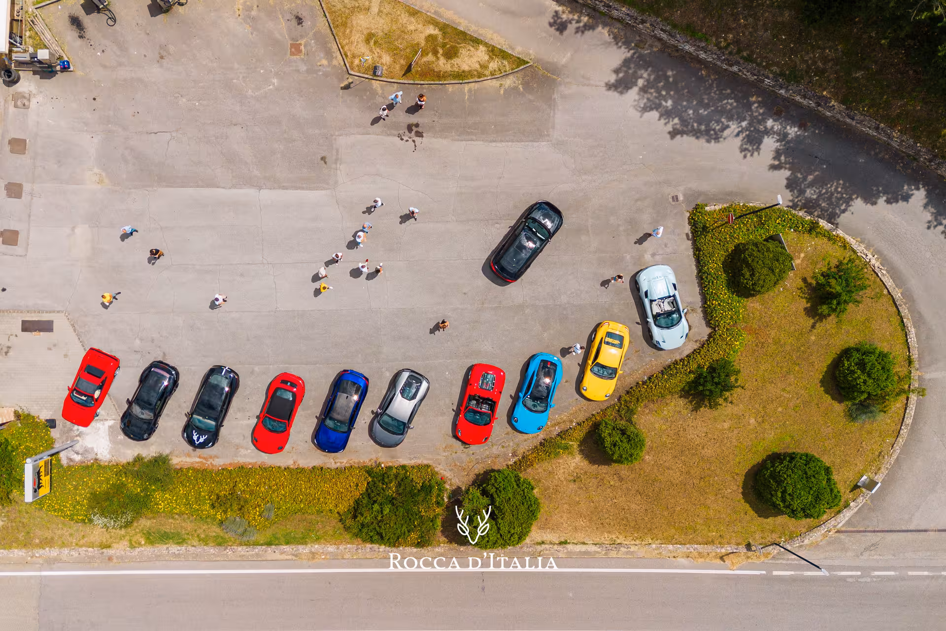 Aerial view of colorful supercars parked in Tuscany during a private supercar tour in Val d'Orcia