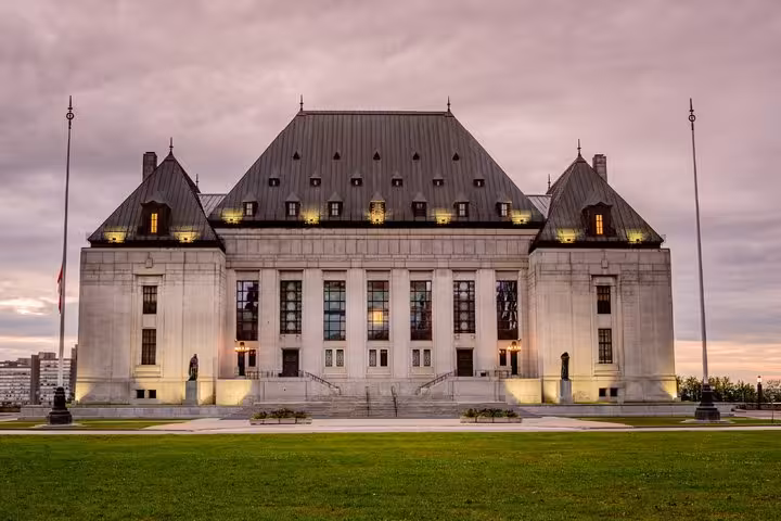 Supreme Court of Canada building illuminated at dusk during Ottawa walking tour