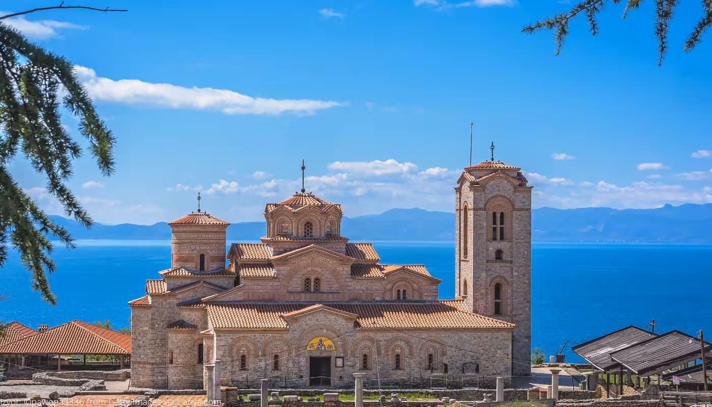Stunning view of Sveti Kliment Ohridski Church with Lake Ohrid backdrop, perfect for Balkan Explorer tours.