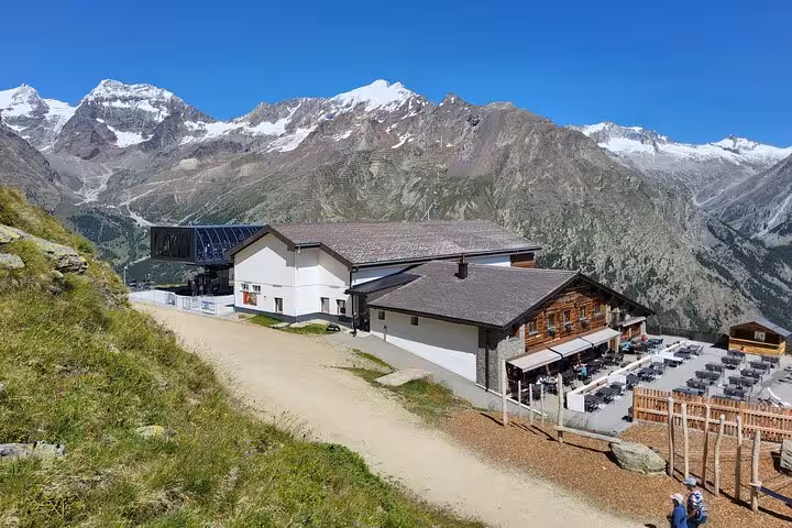 Mountain restaurant viewpoint in the Swiss Alps, a scenic stop on 4-day Zermatt and Jungfrau tour
