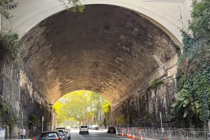 Discover Sydney's hidden gems with a walking tour under the historic Argyle Cut tunnel, showcasing unique architecture.