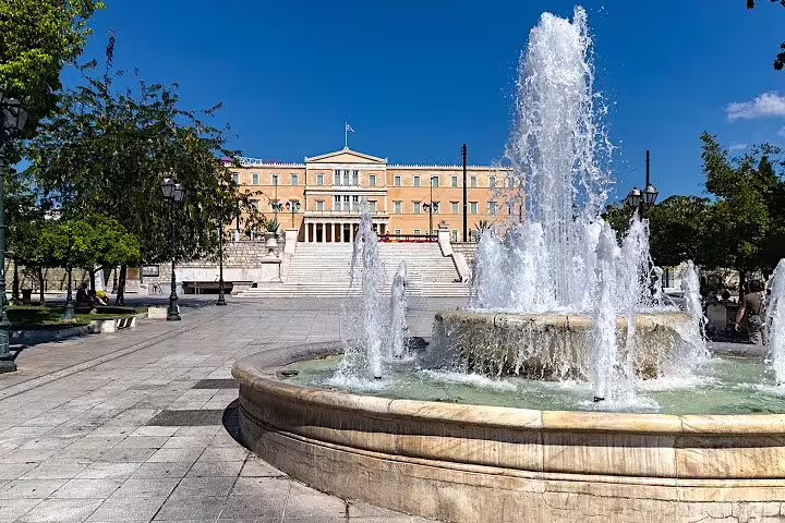 Syntagma Square fountain with Hellenic Parliament in Athens on private Athens Highlights & Ancient Corinth tour