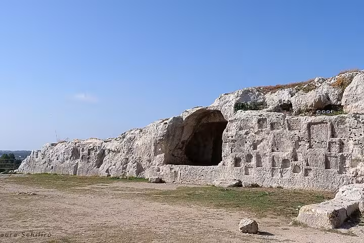 Explore the ancient rock-cut tombs at Syracuse's Necropolis, a historical gem on your Syracuse and Noto tour.