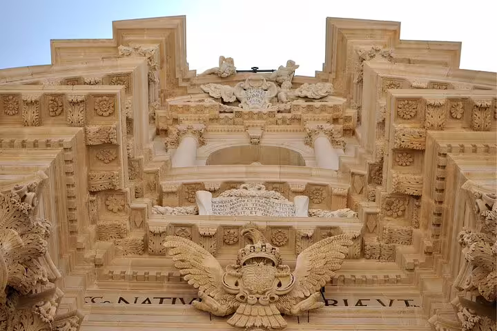 Baroque stone facade details in Ortigia, Syracuse, featured on a self-guided scavenger hunt and highlights tour