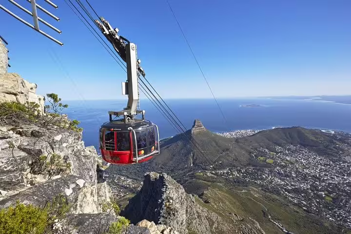 Scenic cable car ride on Table Mountain with panoramic views of Cape Town and Lion's Head, ideal for a 2-day tour.