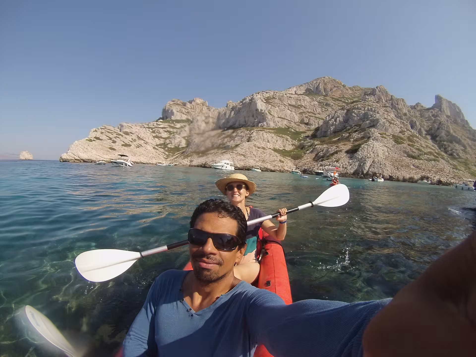 Selfie on a tandem kayak in Marseille Calanques, paddling past rocky coves and islands on a guided sea tour
