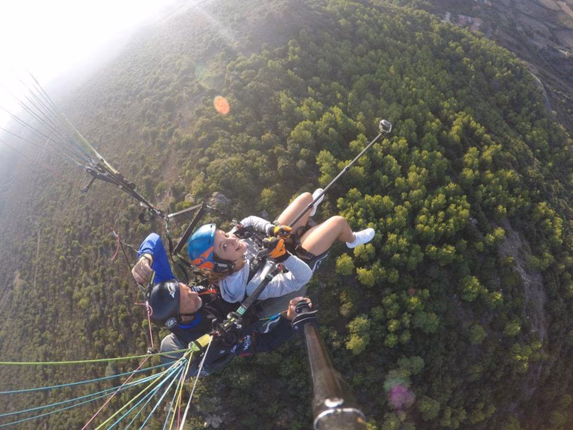 Discover the thrill of tandem paragliding in Littigheddu, enjoying panoramic views of Castelsardo's vibrant greenery.