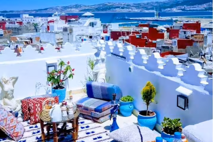 Tangier rooftop terrace with sea view and Moroccan decor, relaxing stay on 12-day tour from Tanger