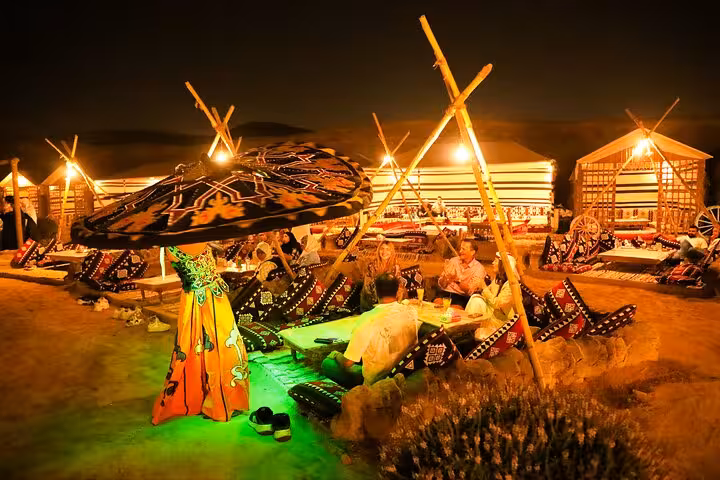 Tanoura dancer and guests at VIP Arabian Night Bedouin desert camp dinner show in Giza, free photographer