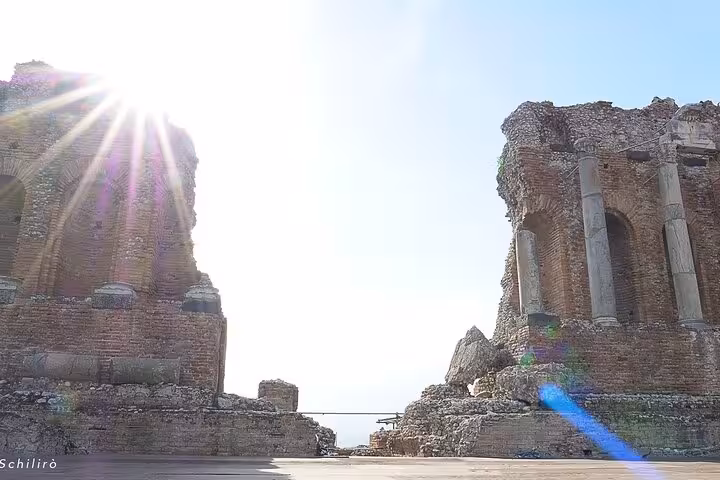 Sunlit ruins of the ancient Greek theater in Taormina, perfect for history lovers on the Etna and Taormina Tour.